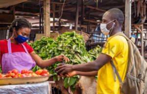 An Errand Runner picking grocery from a vendor